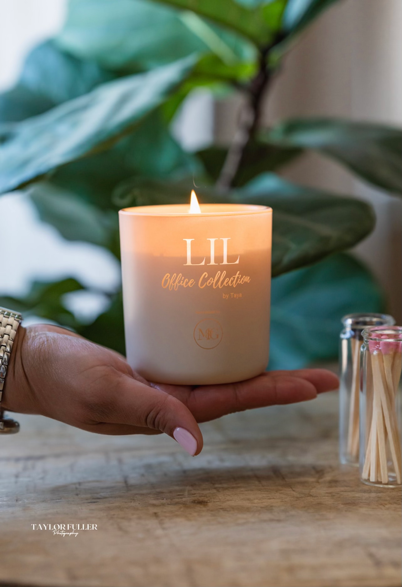 Custom branded candles from the Mae & George x LIL collaboration — engraved glass vessels with logo design